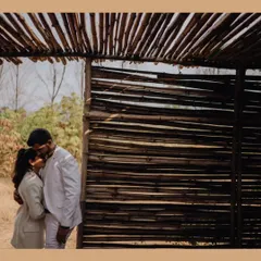 A rustic and romantic pre-wedding shot. The natural textures and the couple's gentle embrace create a beautifully serene portrait.