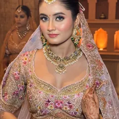 A confident and modern bridal look. The makeup is subtle yet impactful, letting the bride's natural beauty shine through.