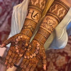 Your mehendi should tell your story. Here, I included the couple's initials and a special teddy bear design to celebrate their journey. I can customize your mehendi with names, dates, or any symbol that's meaningful to you.