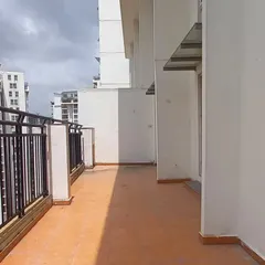 **BEFORE:** A standard, unused penthouse balcony with plain terracotta tiles and an exposed railing, offering little function or appeal.