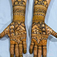 A stunning full-hand bridal design featuring a procession of royal elephants. The intricate details on the elephants and the surrounding patterns create a rich and luxurious look.
