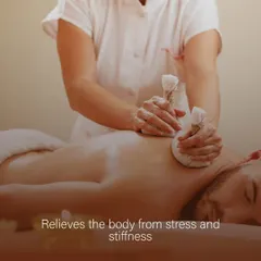 Here, a therapist applies a warm herbal potli to the client's back. This technique is particularly effective for relieving the body from accumulated stress and stiffness in the muscles.