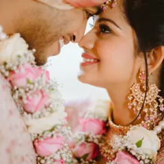 In the quiet moments, love speaks the loudest. This intimate close-up captures the pure joy and connection between a bride and groom, where a simple smile and gentle touch tell the entire story. I focus on these unscripted feelings to make your wedding album truly personal.