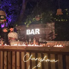 A close-up of our signature fire bar effect. This controlled line of fire along the bar counter creates an incredible visual, especially at night, and is a guaranteed showstopper for any wedding or party.