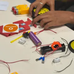 A table full of parts and possibilities at our Yahoo India workshop. Kids dove right in to build their own electric cars and scribble bots.