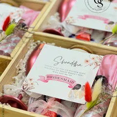 Asking your best friends to be your bridesmaids is a once-in-a-lifetime moment. This personalized proposal box is filled with everything needed to make them feel cherished, including a custom-named wine glass, sparkling rosé, and other pampering essentials, all nestled in a keepsake wooden crate with their name on it.