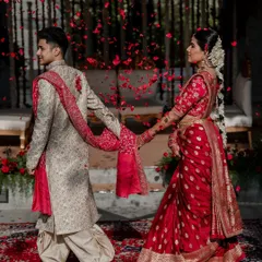 We live for moments like these. A grand exit under a shower of petals for Laksha and Partha, perfectly capturing the magic of their Sabyasachi and Tarun Tahiliani ensembles at the breathtaking Amitarasa venue.
