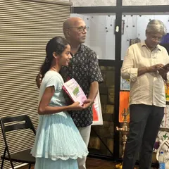 A special moment from our exhibition, where I presented Saanvi Rane with her 'A' grade certificate in front of her peers and parents.