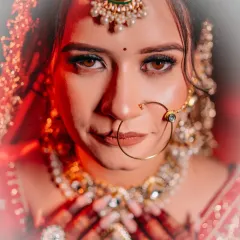 A bride's eyes tell a story of hope, love, and anticipation. I love creating intense, artistic bridal portraits like this one, using dramatic lighting to highlight the emotion and intricate details of the bridal jewellery and makeup.