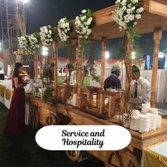 To add a unique touch, I can arrange special serving stations like this rustic wooden cart. It's a great way to create an interactive food corner for items like desserts or welcome drinks.