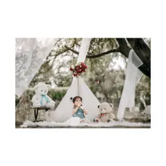 A quiet moment of play during an outdoor teepee session. The soft, natural light and dreamy setup make for beautiful and timeless photos.
