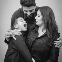 Pure, unscripted joy. This black and white studio shot perfectly captures the fun and energy of a family photoshoot with us.