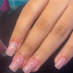 Abstract silver chrome art on natural pink extensions for a modern and chic look.