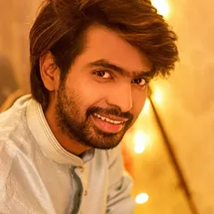 Festive shoots are for everyone! A happy, smiling portrait of Prathamesh Parab, capturing the joyful spirit of Diwali with a backdrop of fairy lights.
