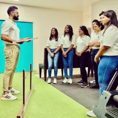 I believe in leading from the front. Here, I am conducting a training session for my team on advanced assessment techniques, ensuring we all stay at the forefront of physiotherapy practice.