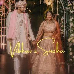 Vibhav and Sneha take their first steps together as husband and wife, walking hand in hand under a beautifully lit archway. This is the beginning of their forever journey.