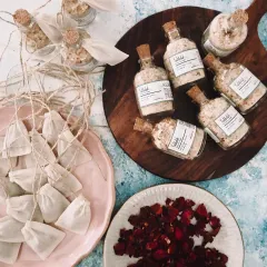 Getting a special order of bath salts and tea bags ready to go. This is a great example of a wellness-focused return gift for events, combining relaxation and natural ingredients.
