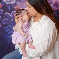 A mother's gentle kiss. These are the moments of pure love I strive to capture during a newborn family session.