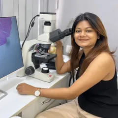 A skin biopsy is a crucial diagnostic tool. Here I am at the microscope, analyzing a sample to ensure an accurate diagnosis, which is the foundation for any effective treatment plan.