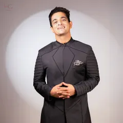 A confident smile in a statement piece. This achkan is designed to make you feel powerful and ready for any grand occasion.