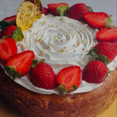 My Strawberry Tea Cake is a simple delight. A fluffy, moist cake is topped with a swirl of cream cheese frosting and a crown of fresh, juicy strawberries.