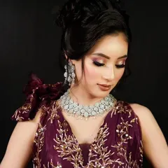 A delicate American Diamond choker worn with an embroidered purple gown, an ideal rental choice for a modern evening event.