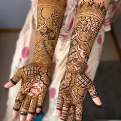 A very special mehendi for a baby shower, with "Baby Coming Soon" written in a heart on the palm.