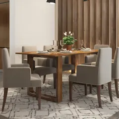 A simple and modern dining setup with comfortable upholstered chairs. The wooden table and slatted wall panel add warmth to the space.