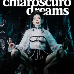 This shot, from a series called 'Chiaroscuro Dreams', is where fashion meets art. I used high-contrast lighting to emphasize the texture of the lace and the sheen of the pearls, creating a powerful, edgy image that was featured in a magazine editorial.