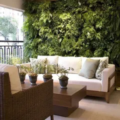 A lush, floor to ceiling live vertical garden transforms this covered balcony into an indoor oasis. We integrate these living walls seamlessly with your interior decor, creating a stunning natural feature that also helps purify the air.