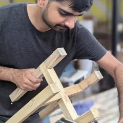 A participant inspecting his hand-cut joinery. There's a huge sense of accomplishment in seeing two pieces of wood fit together perfectly because of the skill in your own hands.