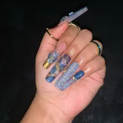 Our advanced nail art modules push creative boundaries. This stunning water-themed set features intricate marble effects, 3D textures, and delicate embellishments, showcasing the high level of artistry our students achieve. We teach you to create complex, professional nail designs that stand out.