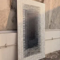 An angled shot of the large textured artwork, emphasizing its three-dimensional quality. This type of piece adds not just color but also a unique architectural element to a wall.