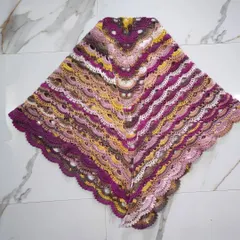 This is the beautiful and intricate Virus Shawl, a very popular pattern in the crochet community. I truly enjoyed watching the gorgeous colors of the papatya batik yarn unfold in these lacy, fan-like stitches. It creates a wonderfully light and airy wrap.