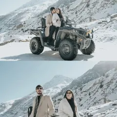 A fun and adventurous shot of a couple on an ATV in the snow, with majestic mountains in the background, showcasing a playful side to their relationship.