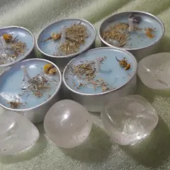 I designed these serenity tealights to bring peace to your space. Each one is made with light blue soy wax, topped with calming herbs, and surrounded by clear quartz crystals for clarity.