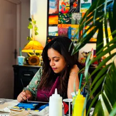 Sanchita, completely in the zone, painting her Starry Night tote bag. It's wonderful to see someone so focused and enjoying the creative process.