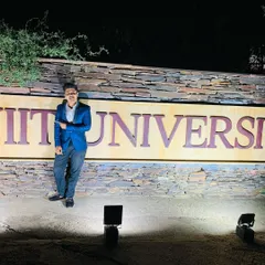 Posing by the NIIT University sign. Performing for students is a unique experience that requires a blend of entertainment and relatability. It's about showing them that the impossible is possible.