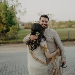 A warm embrace between the couple, their easy chemistry shining through.