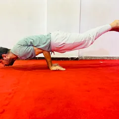 Mayurasana (Peacock Pose) is a powerful arm balance that strengthens the digestive system and builds incredible wrist and shoulder strength.