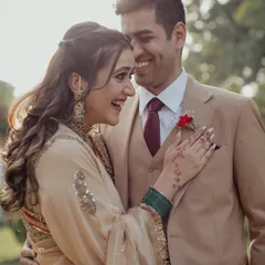 A close-up of the happy couple during their intimate garden engagement, their laughter and connection shining through.