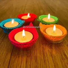 A set of our simple, cup-shaped diya holders in bright, festive colors. These are reusable, washable, and a safe way to add handmade beauty to your festive decor.