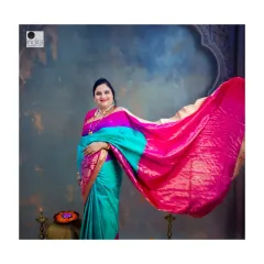 Capturing the beautiful flow of the saree, this shot shows the mother-to-be with the pallu elegantly draped and flowing.