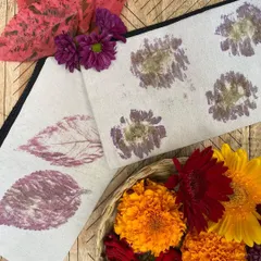 The finished products from our flower pounding workshop. Using locally sourced flowers and leaves, participants created these unique botanical prints on cotton canvas pouches. Each one is a small piece of functional art, capturing the beauty of nature.