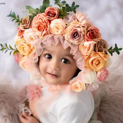 This little one looks so sweet in a beautiful floral bonnet. I have a wide variety of outfits and accessories like this to style your baby's milestone session.