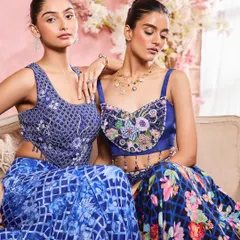 A close-up of two models, highlighting soft, romantic makeup with an emphasis on luminous skin and defined eyes. This style is perfect for a day-to-night transition, suitable for both engagement ceremonies and evening receptions.