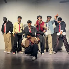 The whole crew posing after a performance. We bring a unified look and a powerful collective energy.