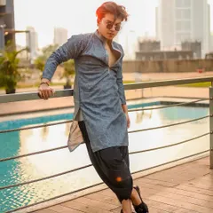 A modern ethnic look for men, shot by a poolside at sunset. This shows how I can style traditional wear in a contemporary and fashionable way for men's portfolios.