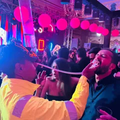 We love bringing interactive fun to the party. Here, one of our bartenders is serving shots directly to a guest using a fun dispenser, creating a high-energy moment that everyone talks about long after the event.