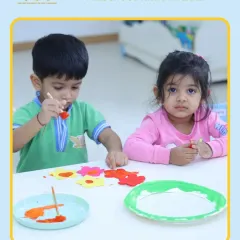 Children paint flower cutouts, a simple yet effective activity for practicing fine motor skills and learning about the colors and shapes of spring.